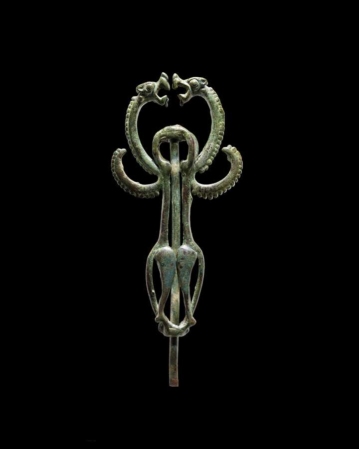 Luristan standard finial of two winged felines confronting one another